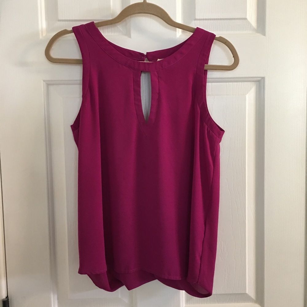 Two of the same blouse, one white, one purple